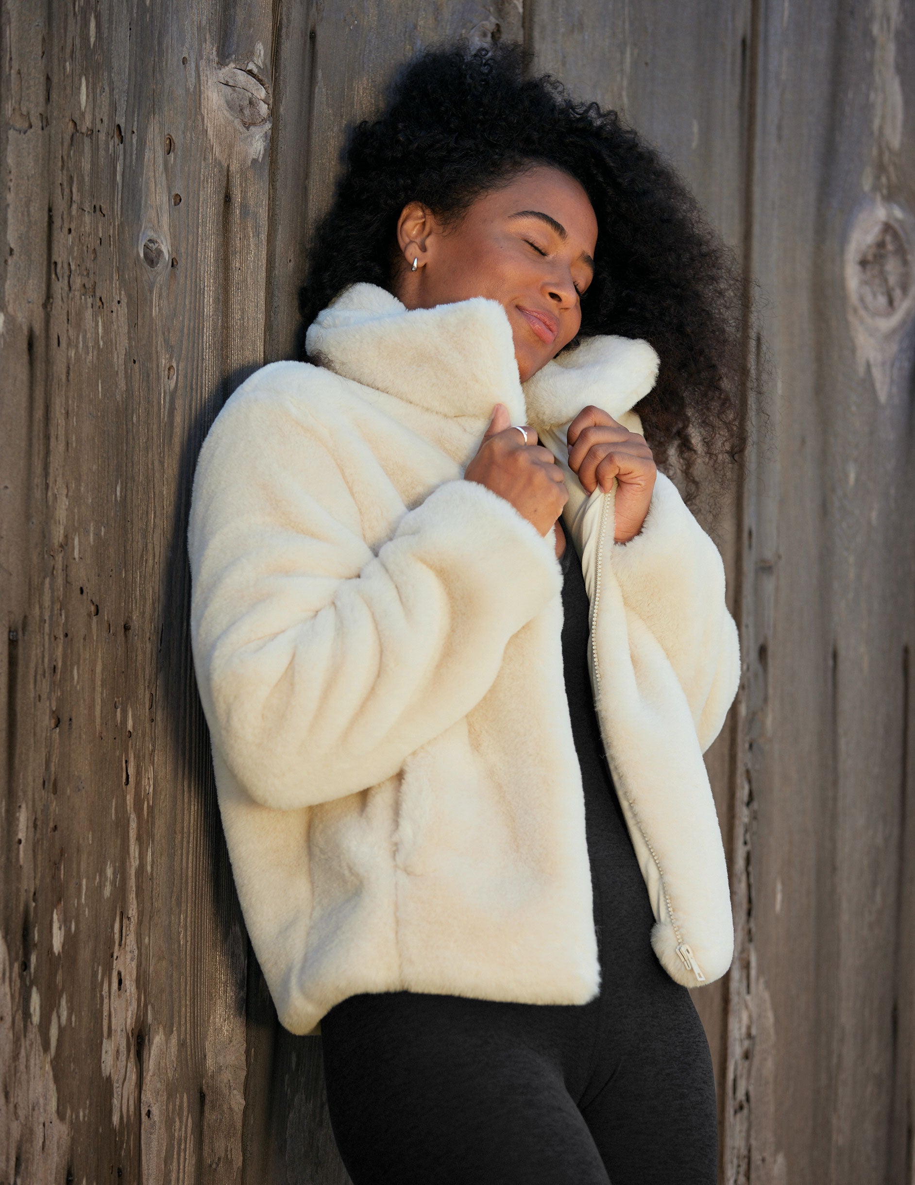 white faux fur zip-up collared jacket.