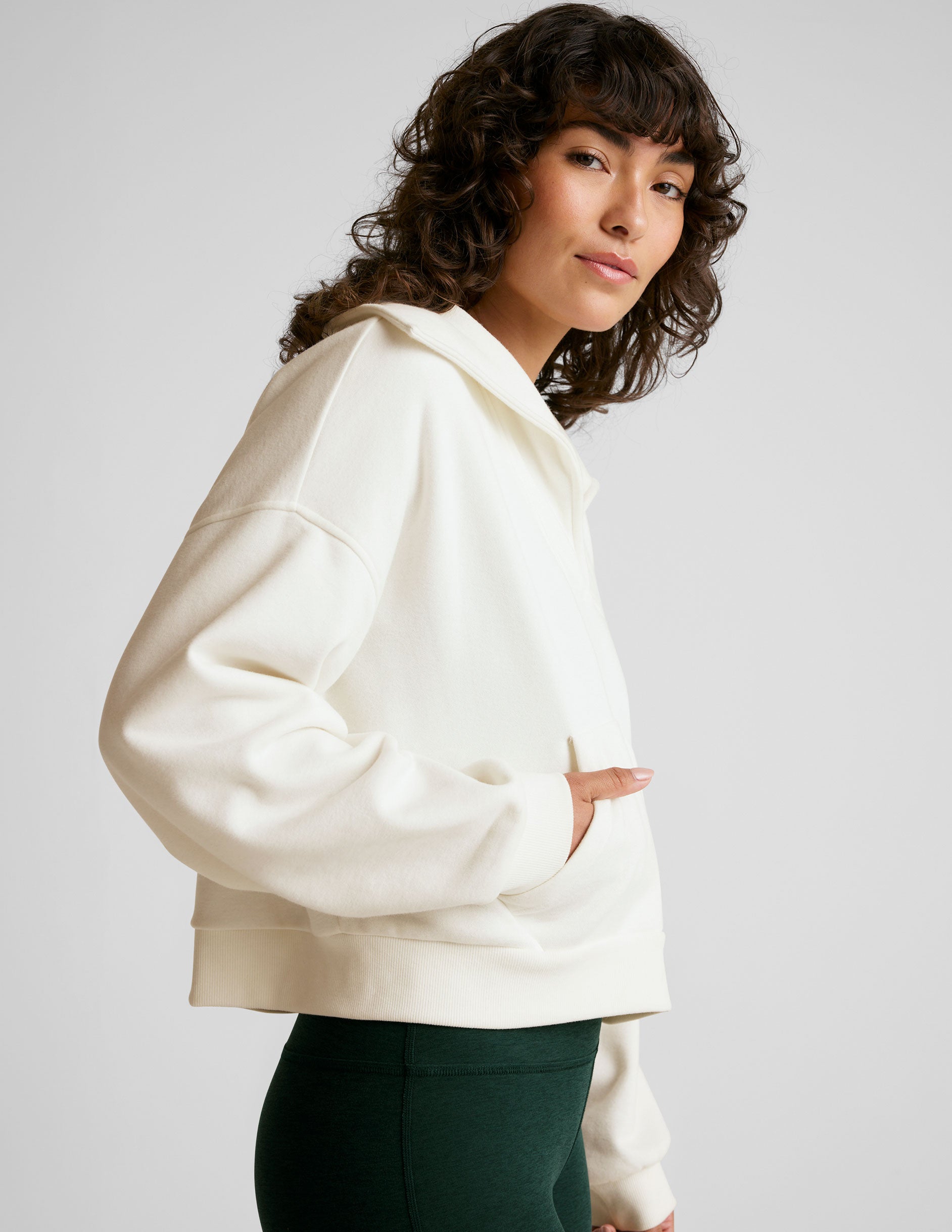 white pullover sweatshirt with a collar and kangaroo pocket.