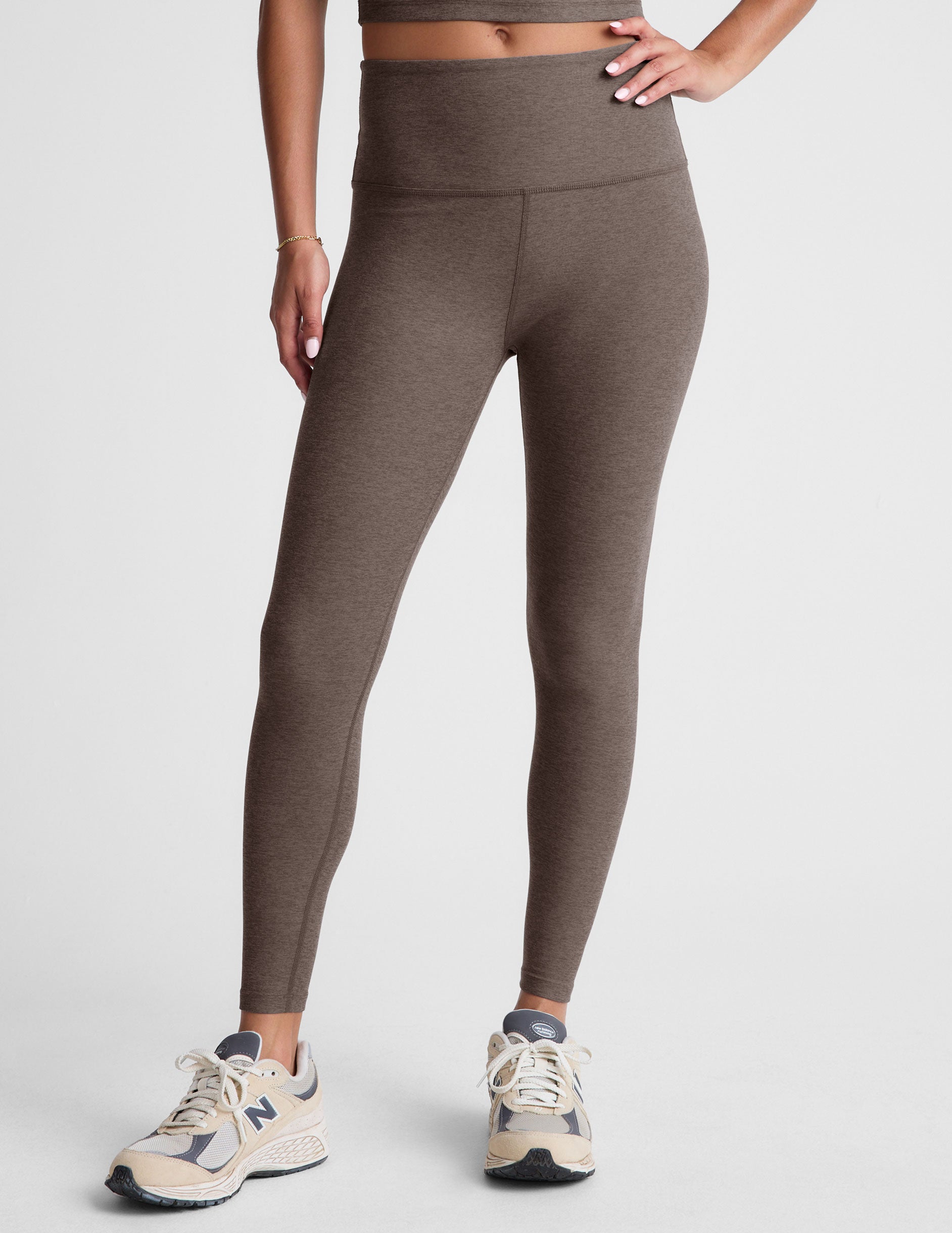 brown high-waisted midi leggings.