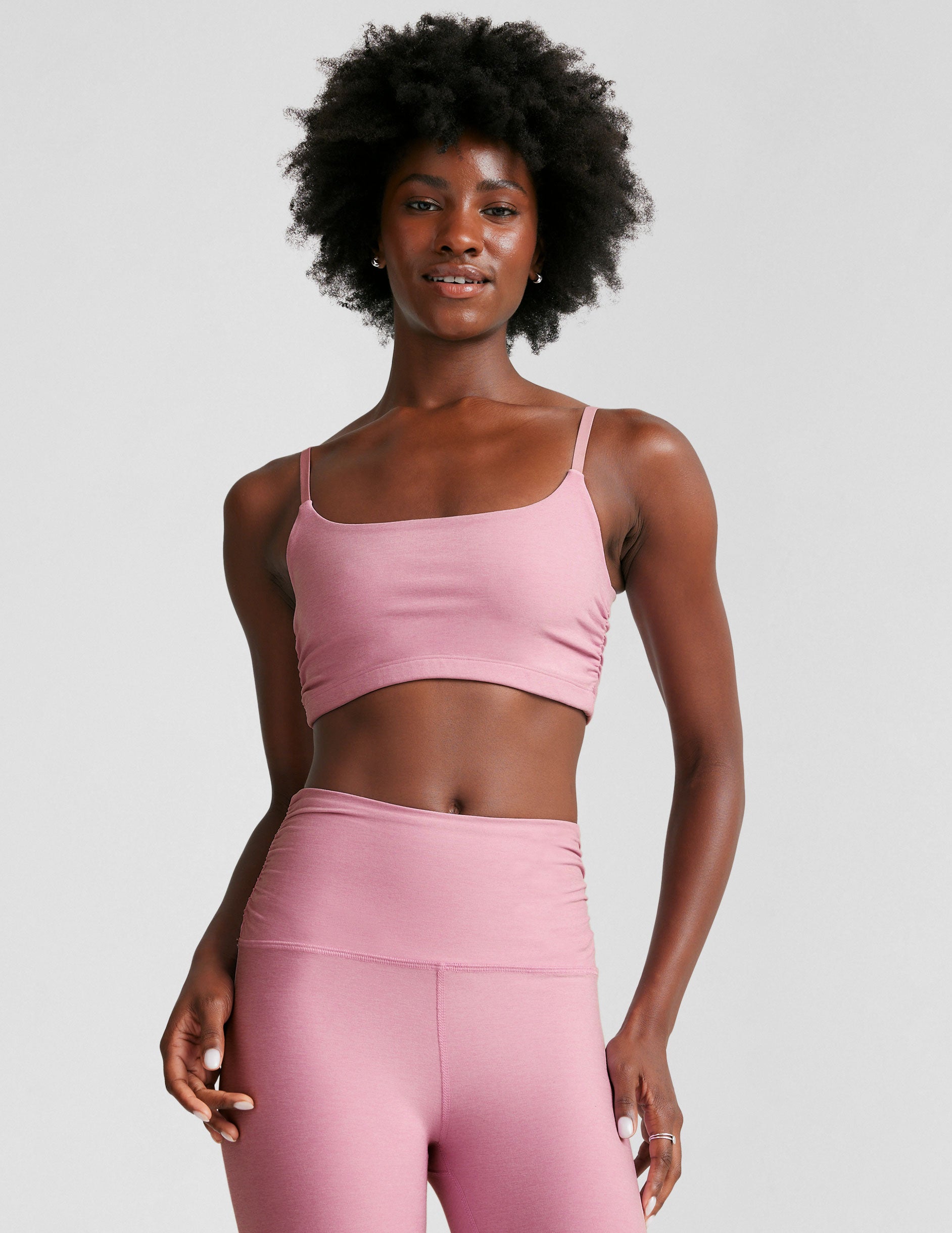 pink bra with adjustable straps and shirred detailing on the side.